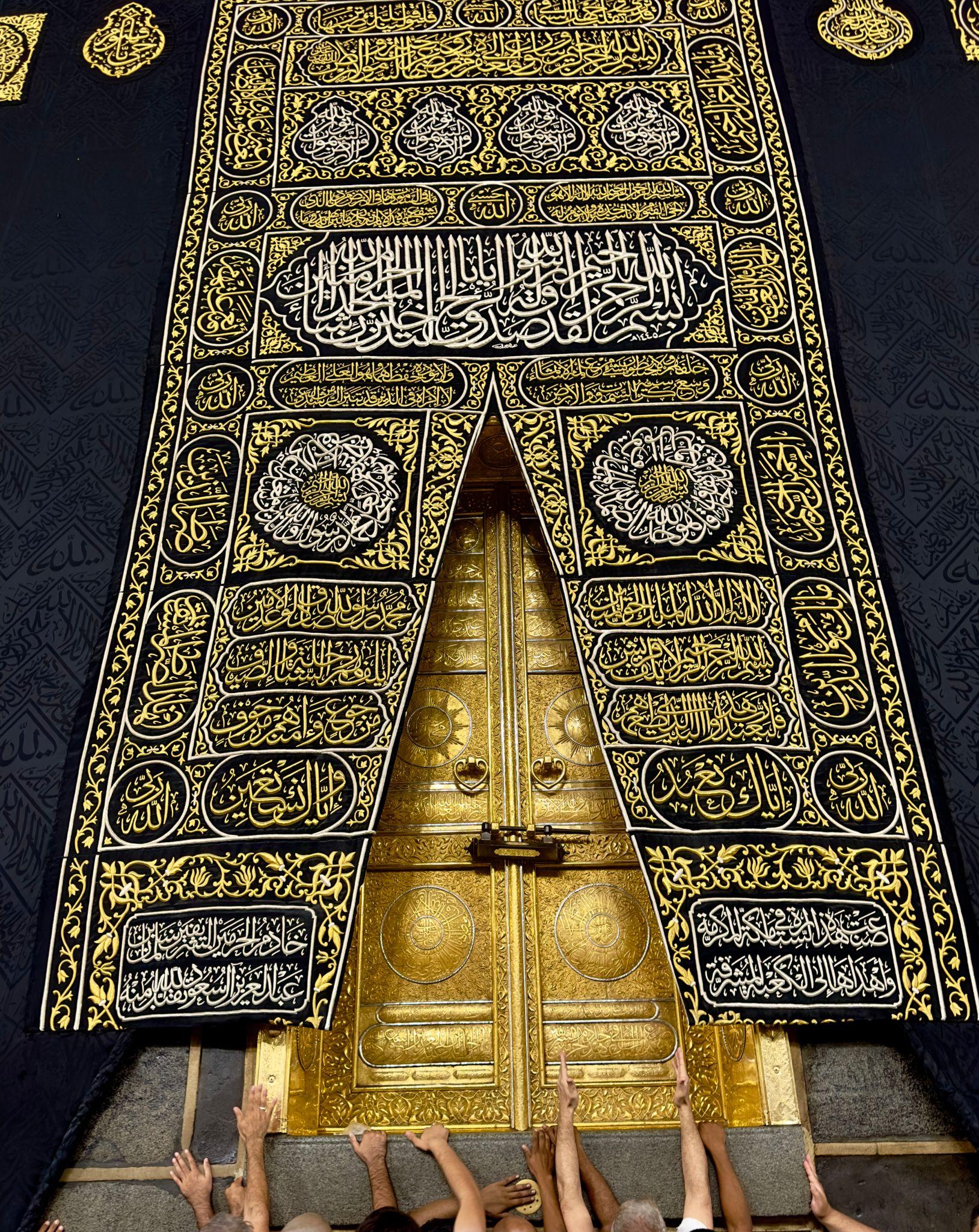 The door of the Ka’bah and its embroidered covering.